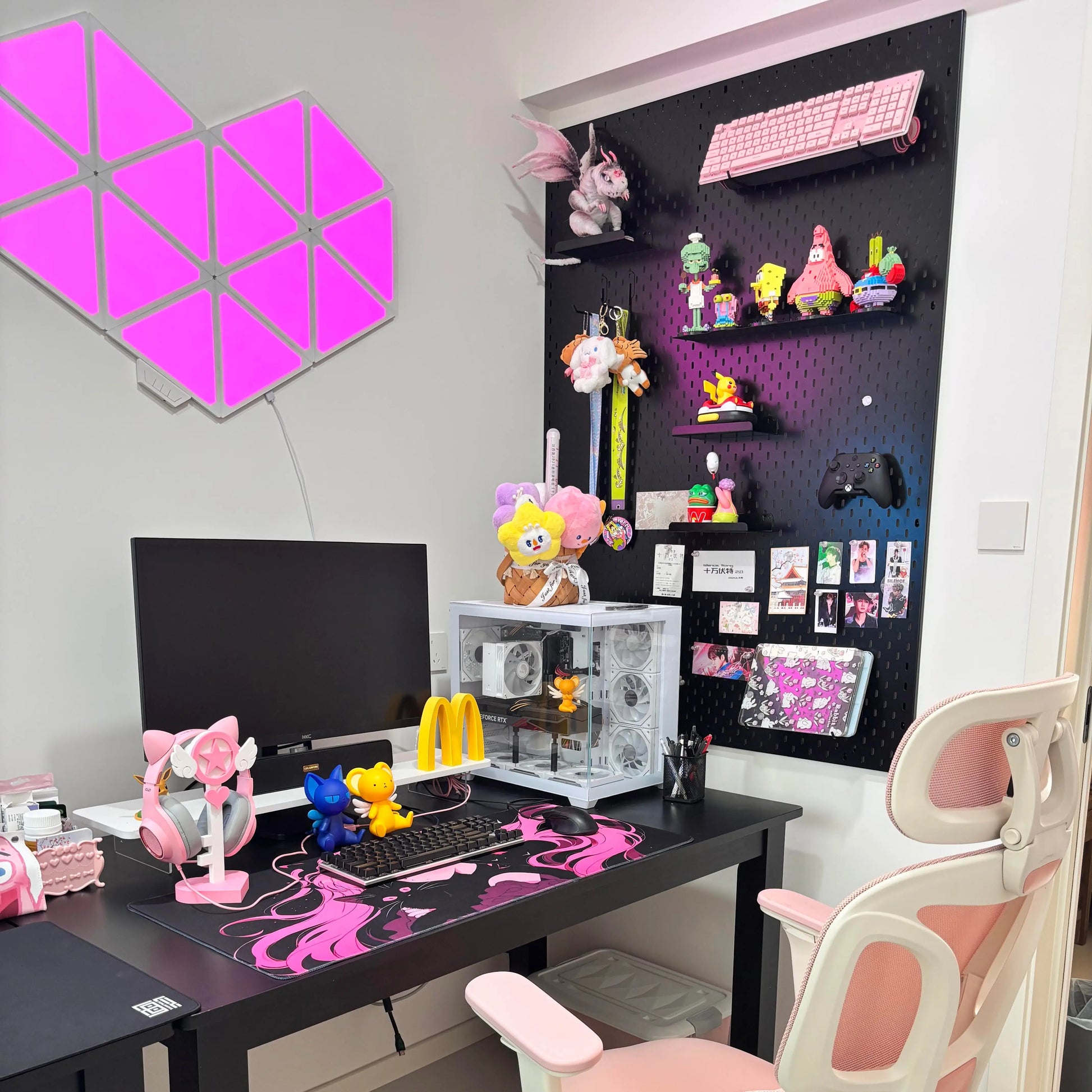 Gaming pegboard storage display with black grid shelves and colorful accessories