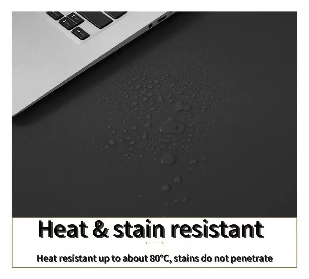 Waterproof desk mat surface with water droplets and heat & stain resistant appearance
