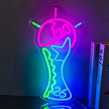 Neon World Cup trophy-shaped sign with pink, teal, green and purple glow