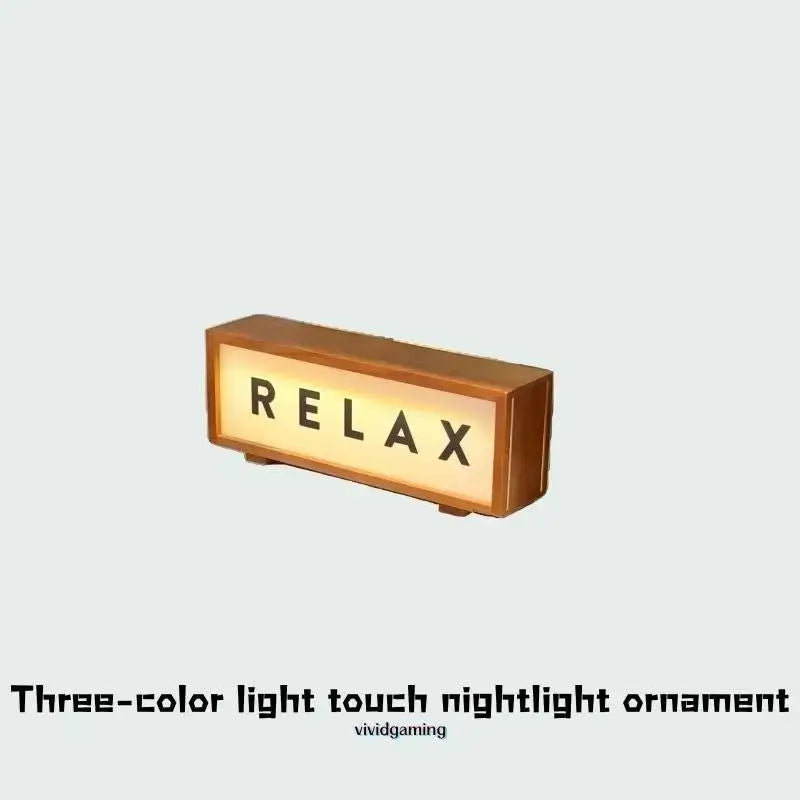 Walnut LED light box displaying RELAX with warm glowing front panel