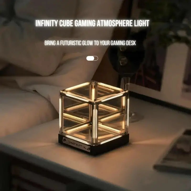 Infinity cube desk lamp with warm golden glow in transparent mirrored cube