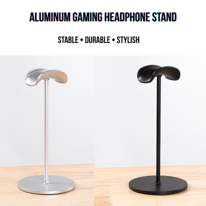 Two Aluminum Gaming Headphone Stands, one silver and one black, are displayed side by side. Each sturdy headset holder features a curved top and round base, perfect for any PC or gaming setup. Stable, durable, and stylish—ideal for your desk.