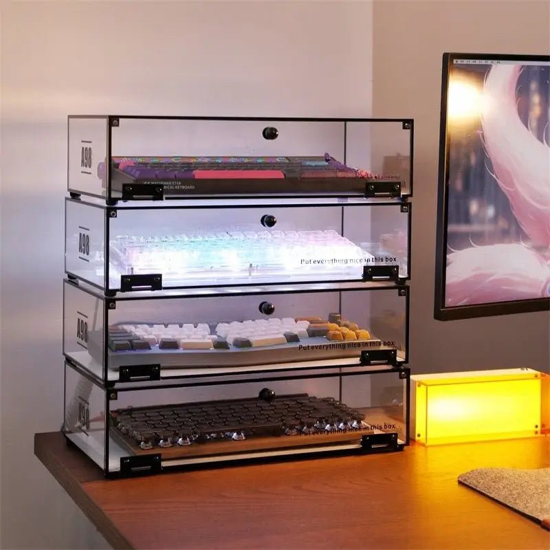 Three-tier stackable keyboard organizer stand with keyboards in clear acrylic boxes, black pins