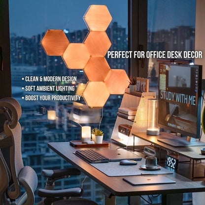 A modern office desk features RGB Hexagon LED Wall Panels – Customizable Gaming Room Lighting, forming hexagonal ambient wall lights behind a computer displaying STUDY WITH ME, with a sleek lamp, keyboard, mouse, and an office chair for boosted productivity.
