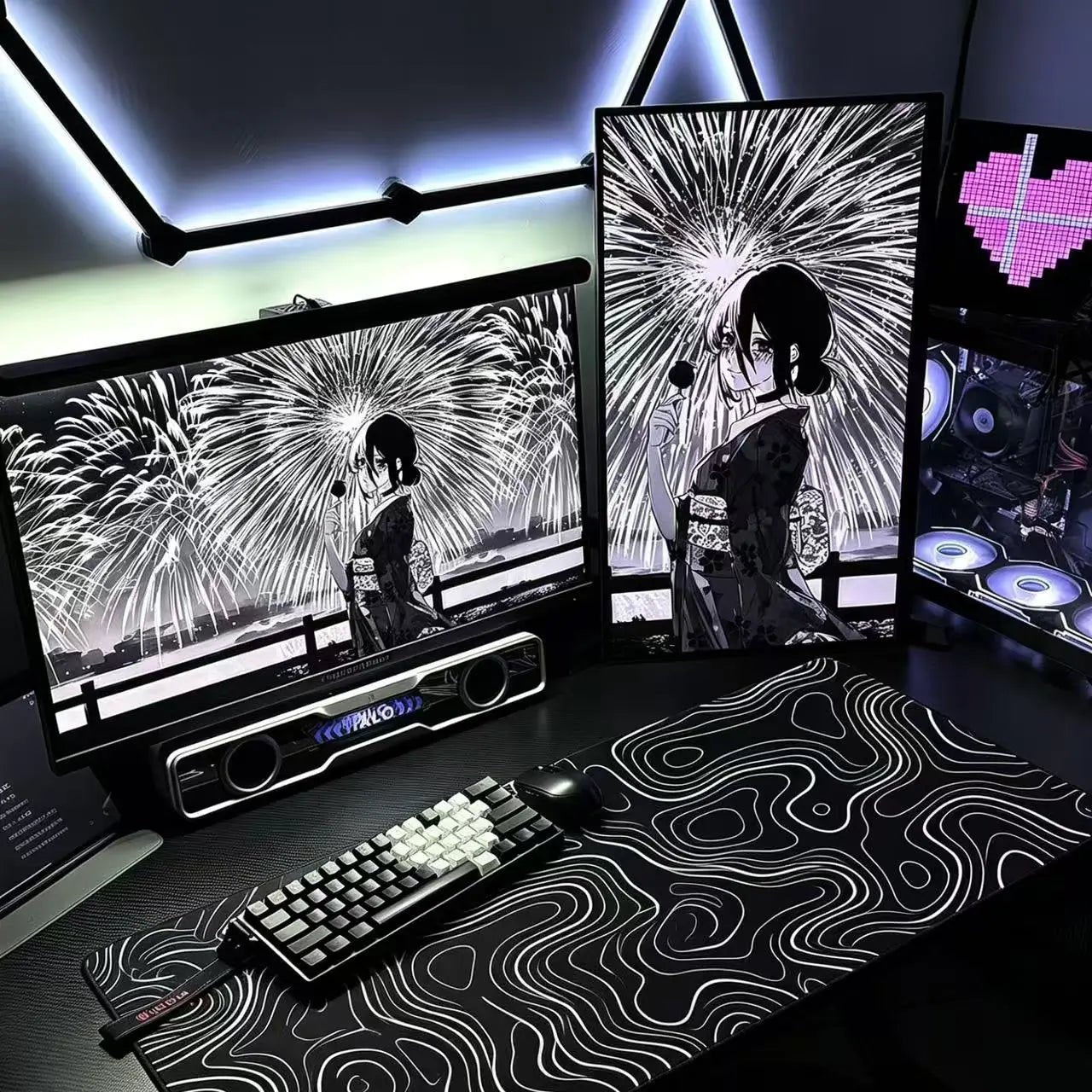 Black desk mat with white topographic contour line pattern and stitched edges