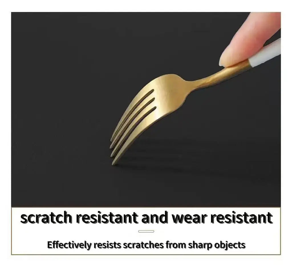 Desk mat surface scratch test, gold fork against dark mat