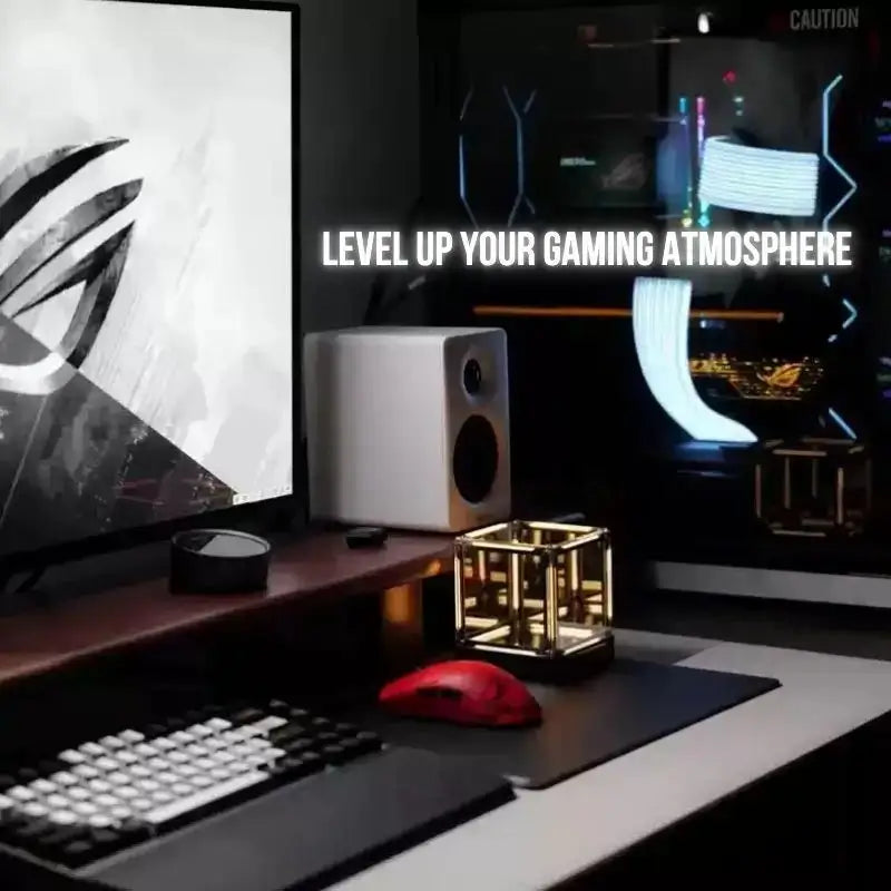 Infinity cube desk lamp on desk with warm golden light inside mirrored frame