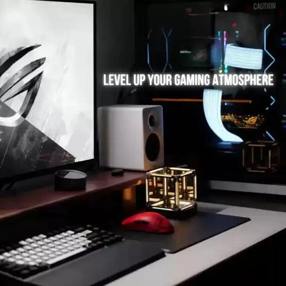 Infinity cube desk lamp on desk with warm golden light inside mirrored frame
