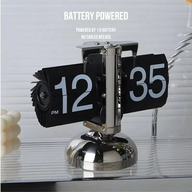 Retro flip clock with black flip pages showing 12 and 35, on chrome pedestal base