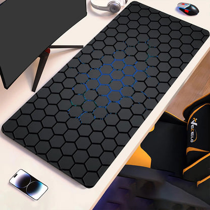 Hex-pattern technical drawing desk pad with blue accents on dark surface