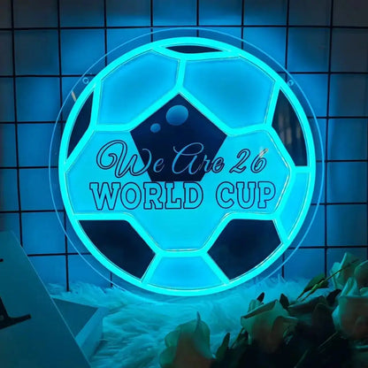 Neon soccer ball World Cup sign in bright blue with “We Are 26 World Cup”