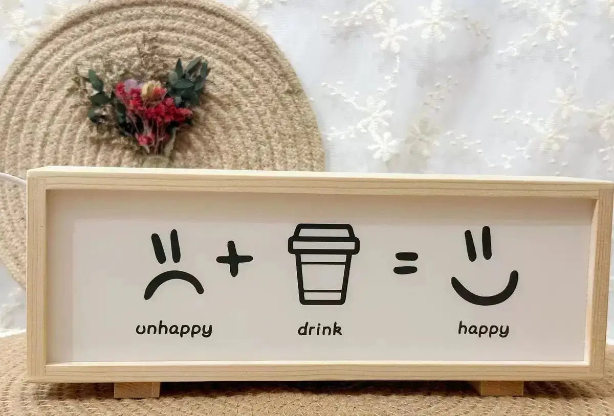 Wood-framed LED light box with unHappy, drink, and happy icons