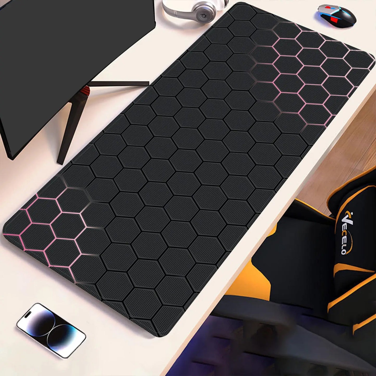 Black hex-pattern desk pad with pink accent hex lines