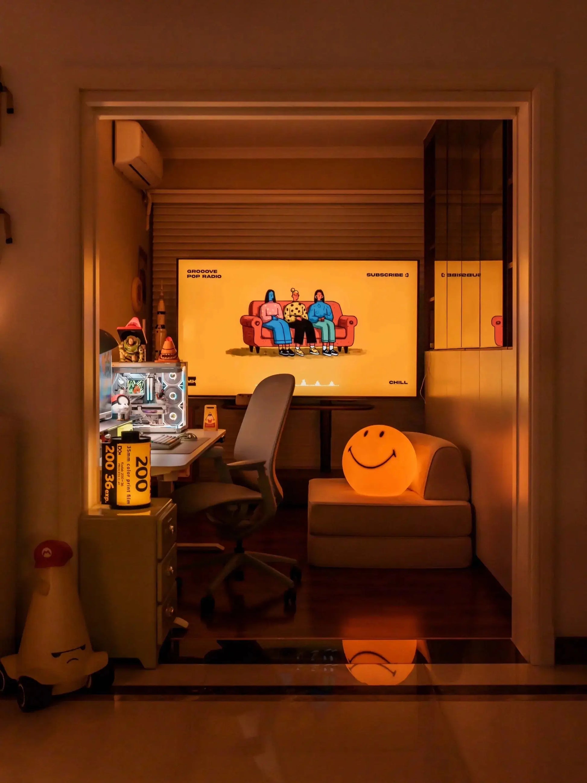 Glowing yellow smiley face LED lamp with black smiling mouth and eyes
