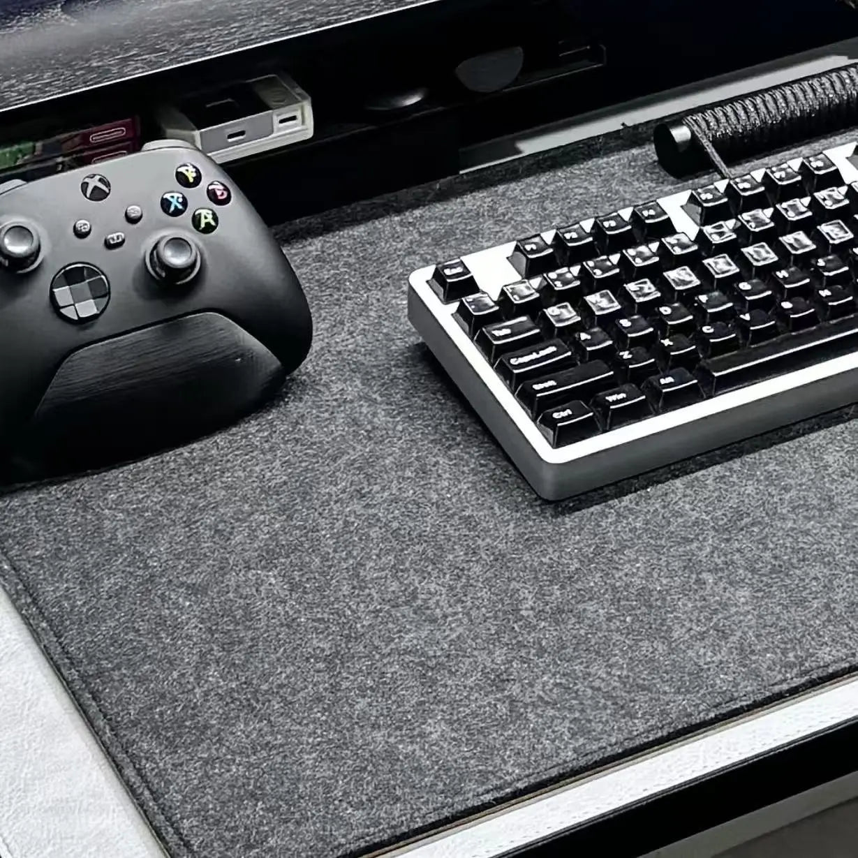 Dark gray felt desk mat with textured surface and non-slip backing