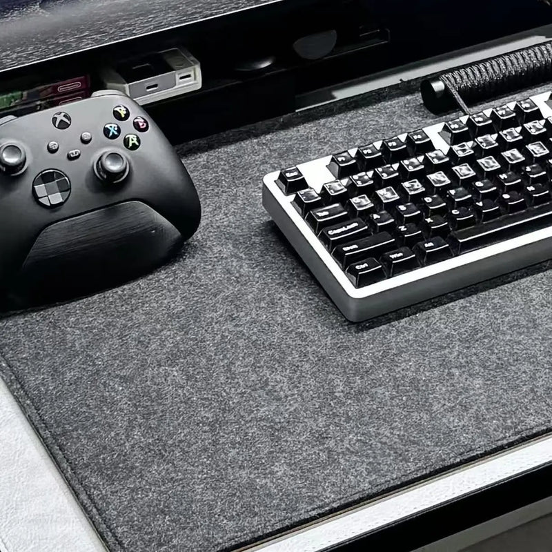 Dark gray felt desk mat with textured surface and non-slip backing