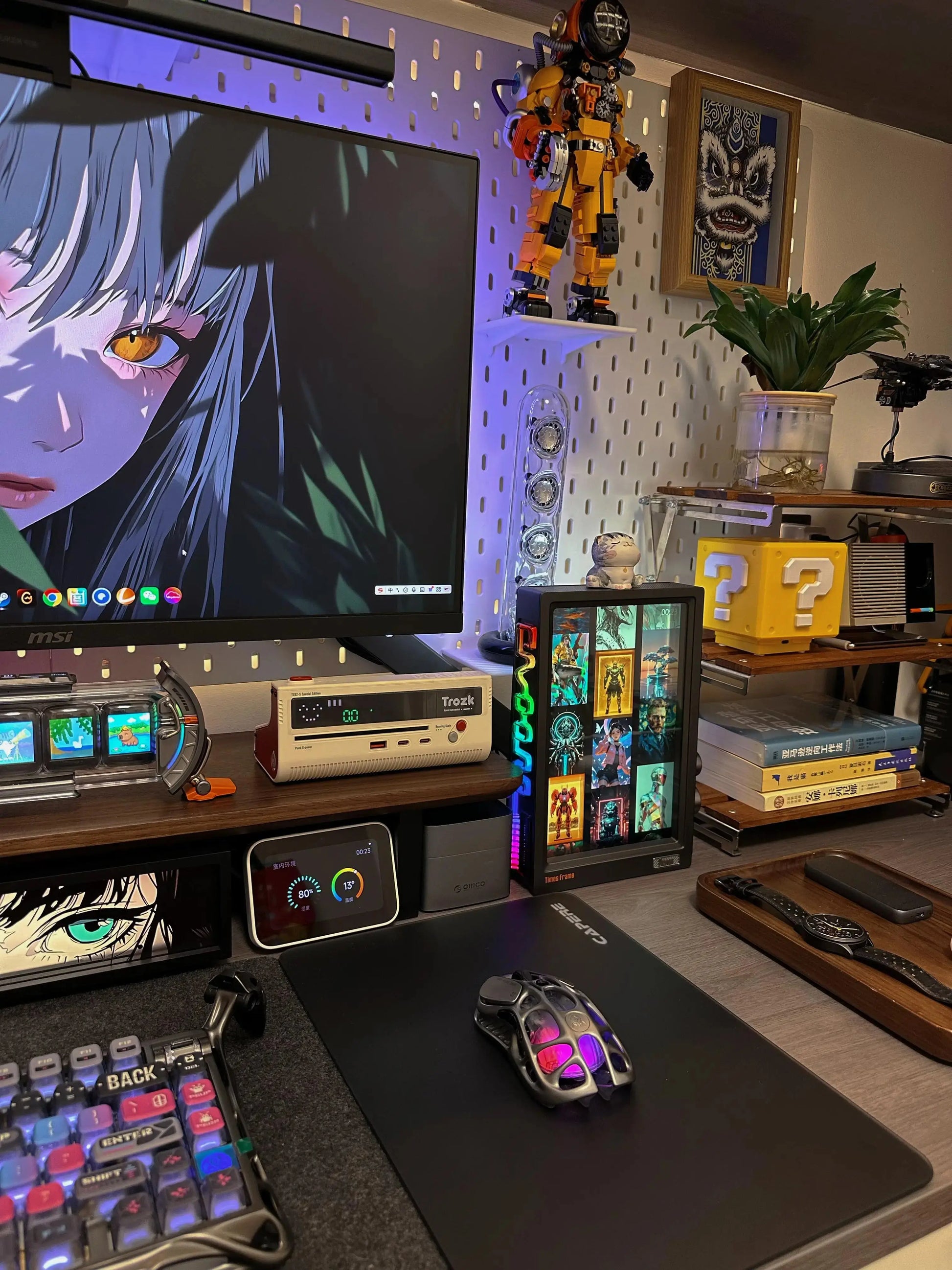 Black RGB pixel art display frame on desk showing pixel screens and glowing side LEDs