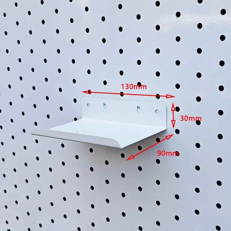 White metal pegboard shelf with shallow tray and rear mounting plate