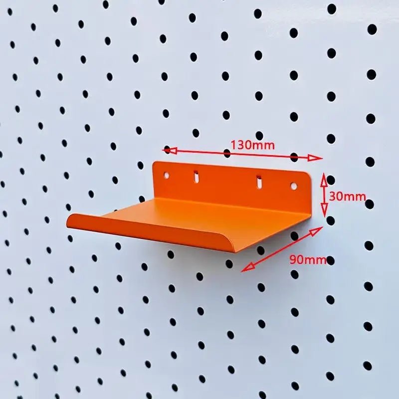 Orange metal pegboard shelf with shallow tray and rear mounting plate