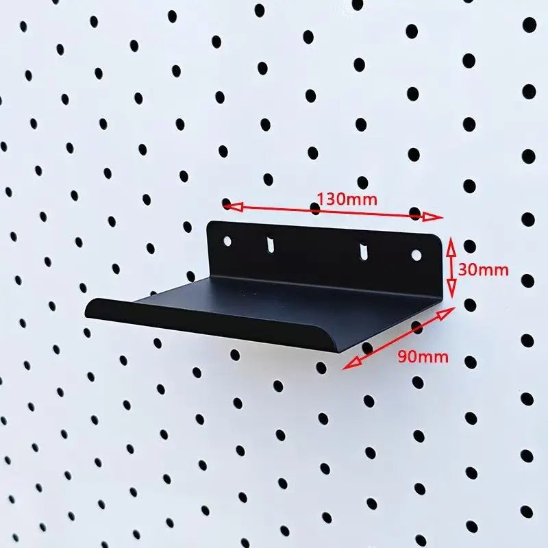 Black metal pegboard shelf with shallow tray and rear mounting plate