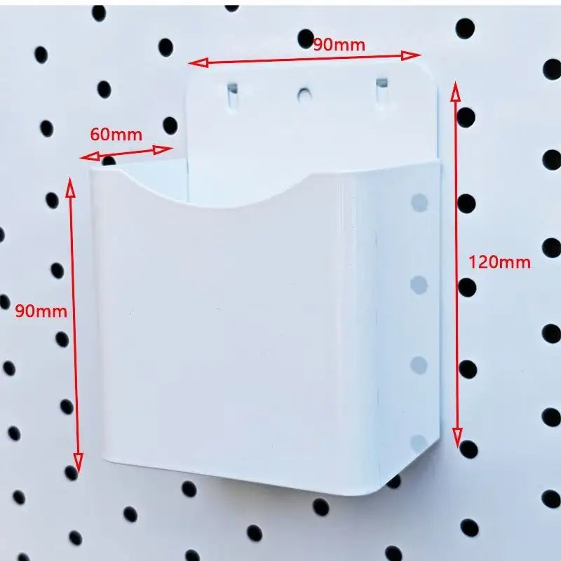 White pegboard organizer bin with open top and mounting holes, size markings