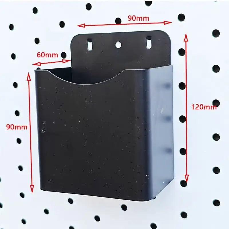 Dark gray pegboard organizer bin with open top and mounting holes, size markings