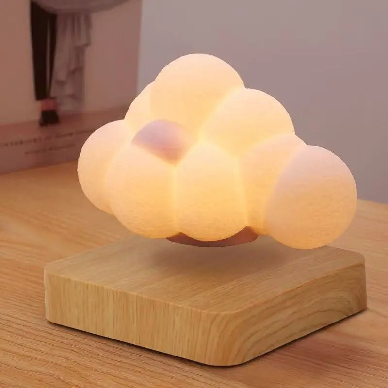 Cloud-shaped LED lamp with warm glow on light wood block base