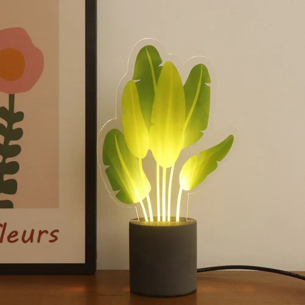Glowing LED snake plant night light with yellow light and dark cement base
