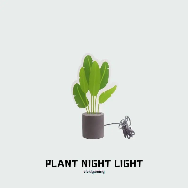 LED snake plant desk light with green leaves, dark cement base, USB cable attached