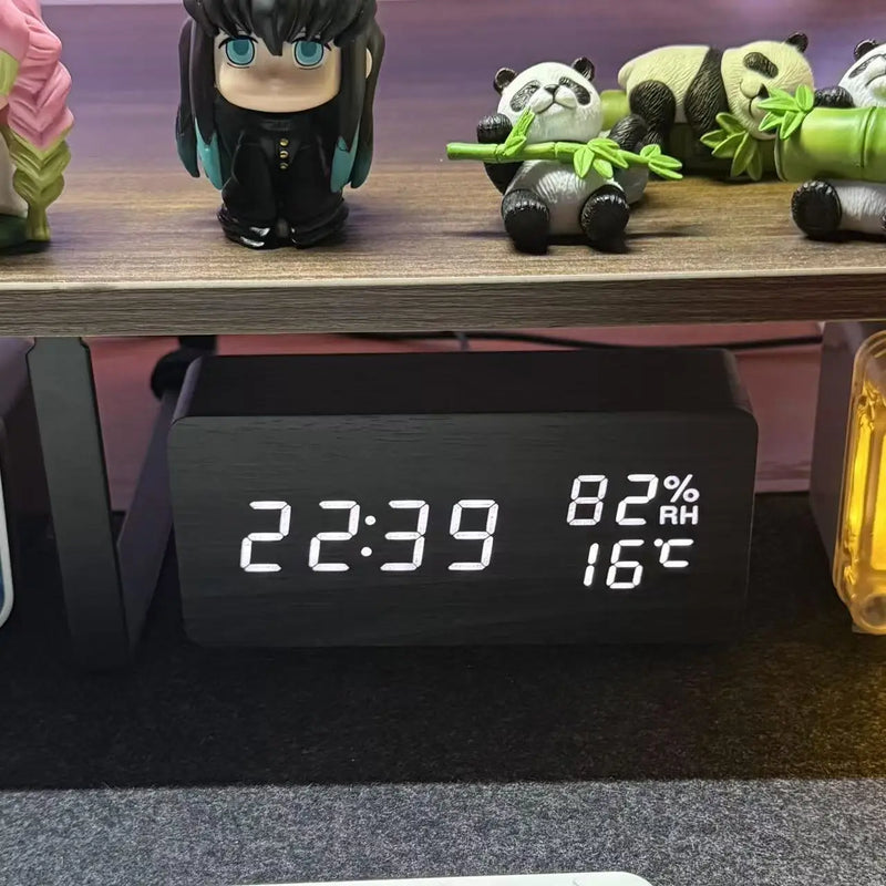 Digital desk clock with LED display reading 22:39, 8% RH, 16°C