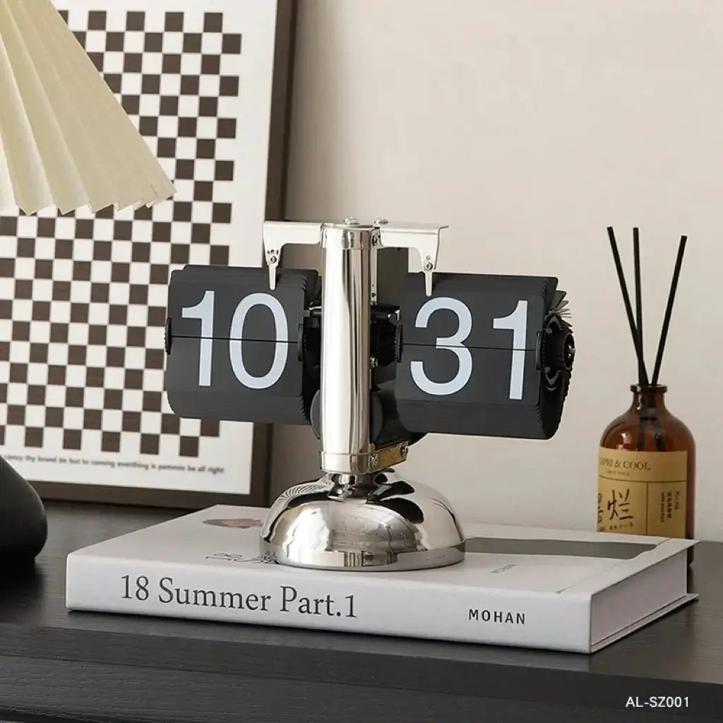 Retro flip clock with black flip pages showing 10 and 31, on white base