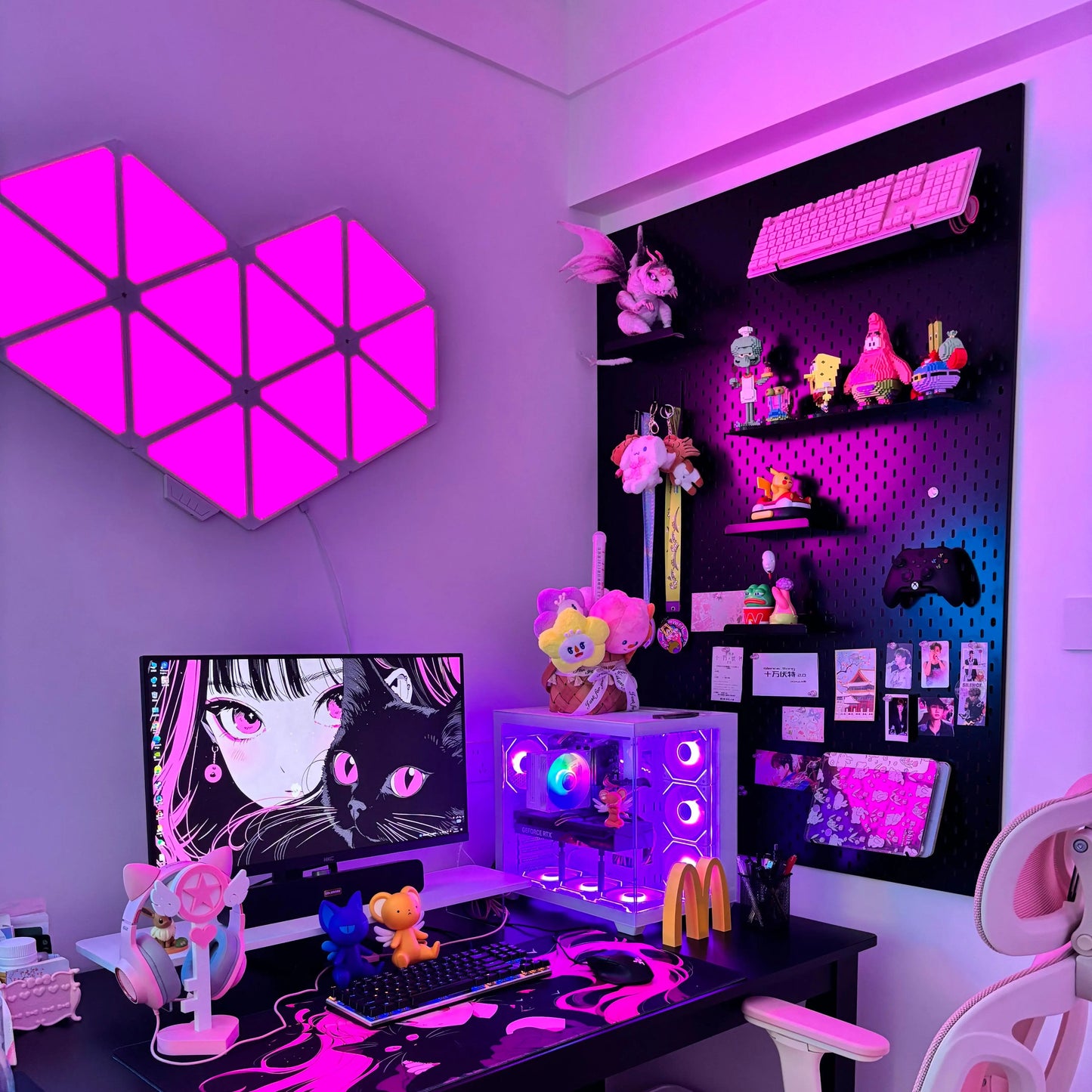 Black pegboard wall organizer with shelves holding gaming figures and decor