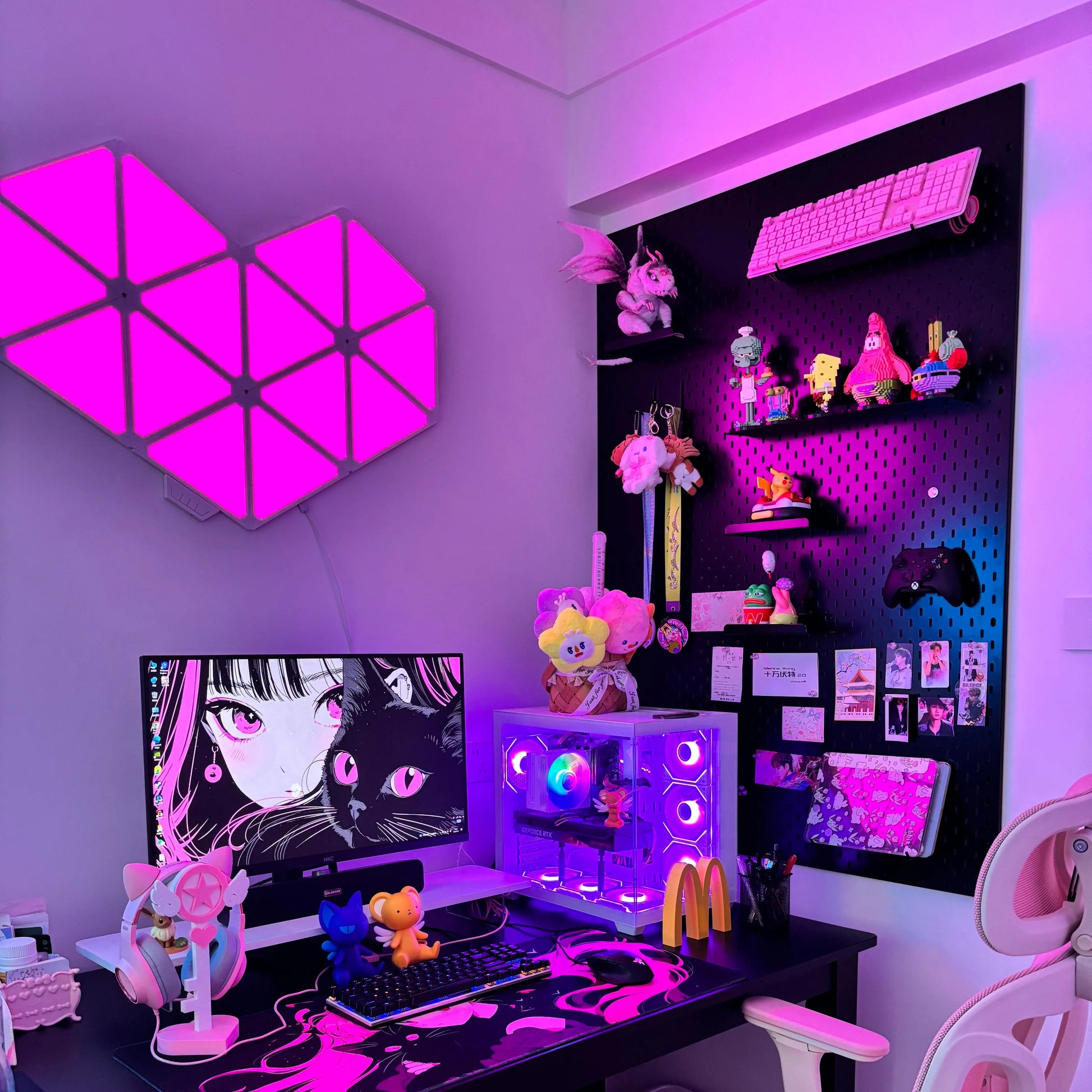 Black pegboard wall organizer with shelves holding gaming figures and decor