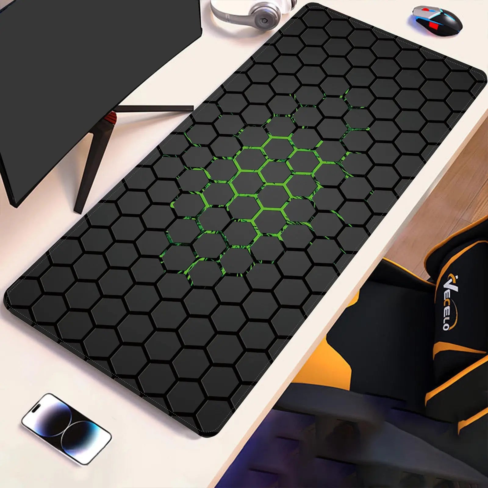 Hex-pattern technical drawing desk pad with neon green accents on dark surface