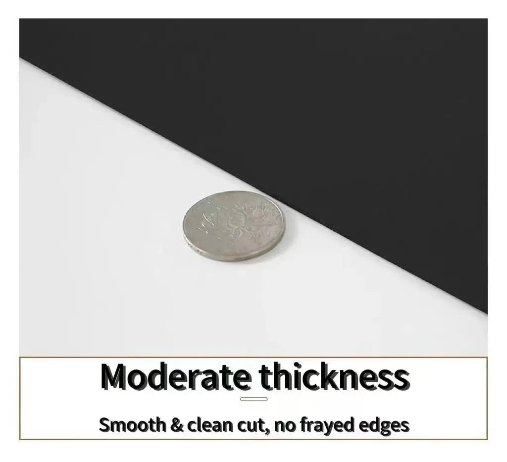 Large desk mat with smooth light surface and coin near seam, moderate thickness