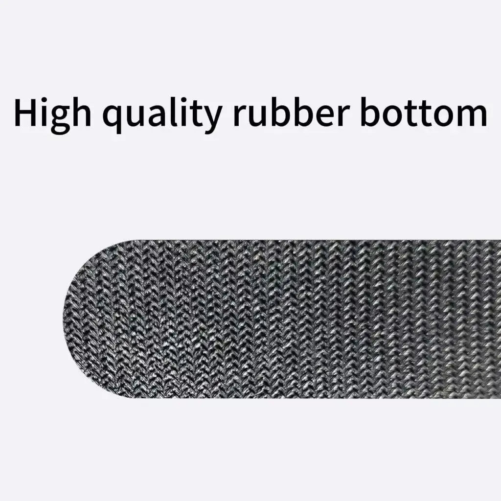 Textured rubber-backed underside of a hex-pattern desk pad in dark gray